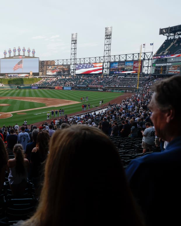 Jul 4, 2022; Chicago, Illinois, USA; Players from the Chicago White Sox and the Minnesota Twins and fans observe a moment of silence to honor the shooting victims from the shooting in Highland Park, Illinois before the game at Guaranteed Rate Field.