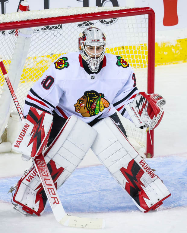 Jan 26, 2023; Calgary, Alberta, CAN; Chicago Blackhawks goaltender Jaxson Stauber (30) guards his net against the Calgary Flames during the first period at Scotiabank Saddledome.