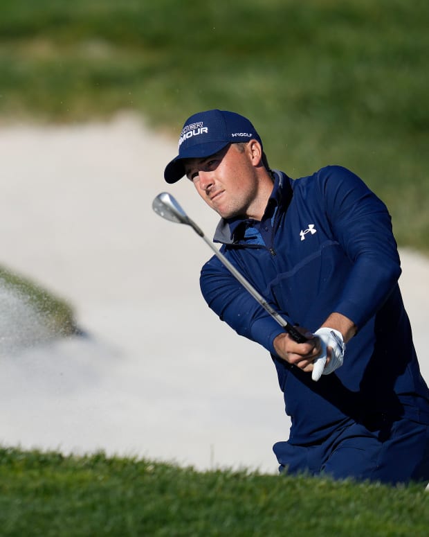 Feb 6, 2022; Pebble Beach, California, USA; Jordan Spieth plays his shot from the 17th bunker during the final round of the AT&T Pebble Beach Pro-Am golf tournament at Pebble Beach Golf Links.