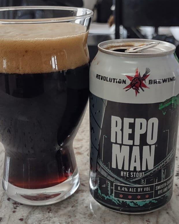 A Revolution Brewing Repo Man can with the beer poured into a glass next to it