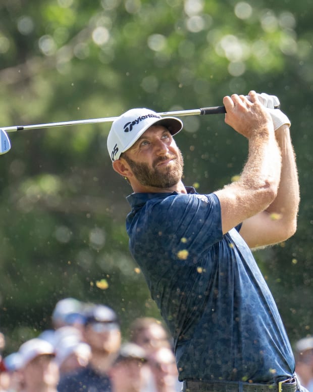 Sep 4, 2022; Boston, Massachusetts, USA; Dustin Johnson captain of team Aces tees off on the 17th during the final round of the LIV Golf tournament at The International.