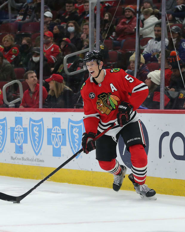 Jan 31, 2022; Chicago, Illinois, USA; Chicago Blackhawks defenseman Connor Murphy (5) with the puck during the third period against the Vancouver Canucks at the United Center.