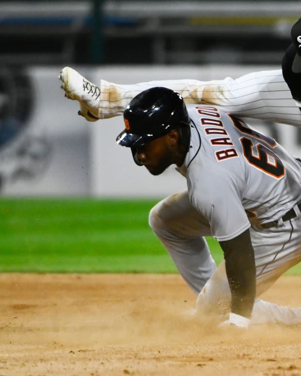 Sep 23, 2022; Chicago, Illinois, USA; Detroit Tigers left fielder Akil Baddoo (60) steals second base under Chicago White Sox shortstop Elvis Andrus (1) during the seventh inning at Guaranteed Rate Field.