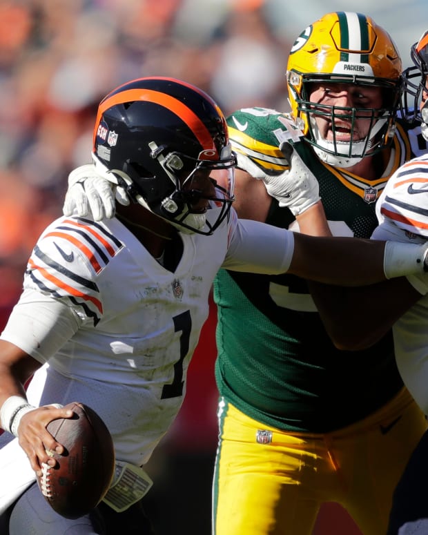 Green Bay Packers defensive end Dean Lowry (94) pressures Chicago Bears quarterback Justin Fields (1) as center Sam Mustipher (67) blocks during the fourth quarter during their football game Sunday, October 17, 2021, at Soldier Field in Chicago, Ill. Green Bay won 24-14.