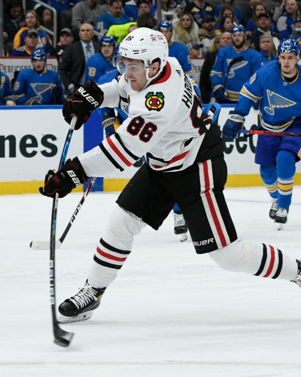 Oct 30, 2021; St. Louis, Missouri, USA; Chicago Blackhawks right wing Mike Hardman (86) shoots the puck against the St. Louis Blues during the first period at Enterprise Center.