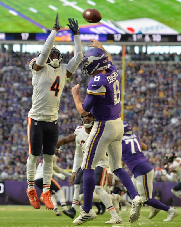 Jan 9, 2022; Minneapolis, Minnesota, USA; Chicago Bears free safety Eddie Jackson (4) defends the pass of Minnesota Vikings quarterback Kirk Cousins (8) during the fourth quarter at U.S. Bank Stadium.