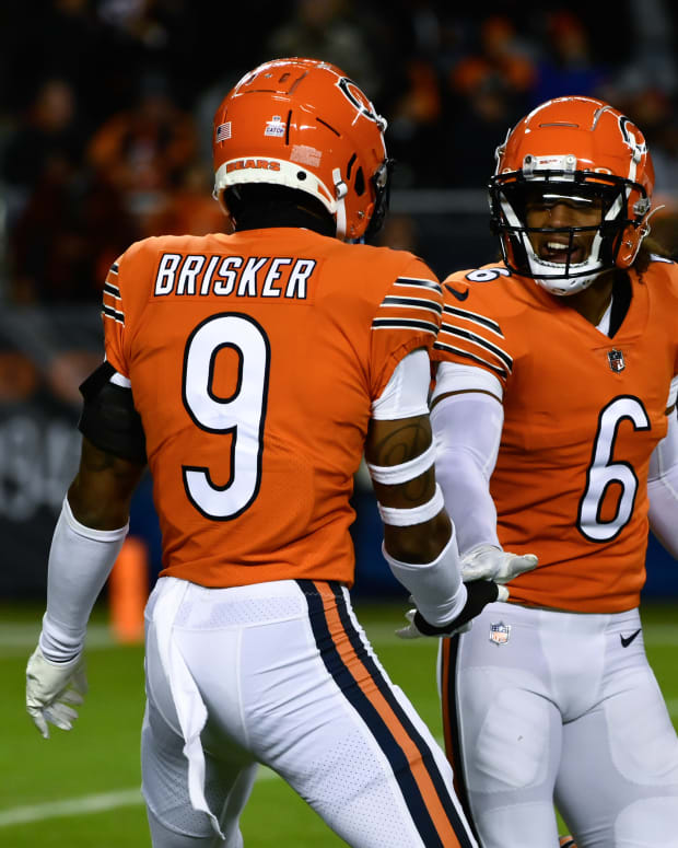 Oct 13, 2022; Chicago, Illinois, USA; Chicago Bears safety Jaquan Brisker (9) and Chicago Bears cornerback Kyler Gordon (6) after Brisker sacked Washington Commanders quarterback Carson Wentz (11) during the first half at Soldier Field.