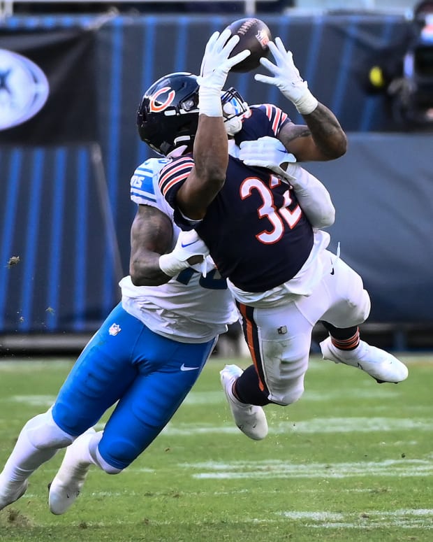 Nov 13, 2022; Chicago, Illinois, USA; Chicago Bears running back David Montgomery (32) is unable to hold onto a pass while being defended by Detroit Lions linebacker Chris Board (49) during the second half at Soldier Field.