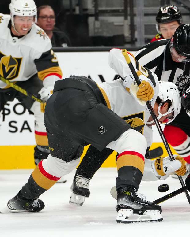 Oct 27, 2023; Las Vegas, Nevada, USA; Chicago Blackhawks center Connor Bedard (98) takes a faceoff against Vegas Golden Knights center Chandler Stephenson (20) during an overtime period at T-Mobile Arena.
