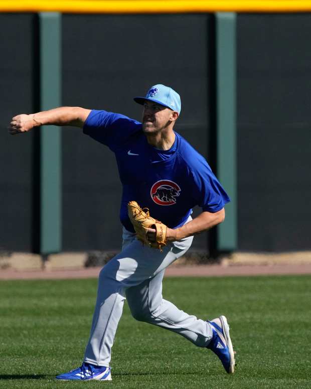 Feb 15, 2024; Mesa, AZ, USA; Chicago Cubs starting pitcher Jameson Taillon (50) throws long toss during Spring Training camp at Sloan Park.