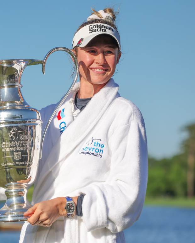 Apr 21, 2024; The Woodlands, Texas, USA; Nelly Korda (USA) poses with the trophy after winning The Chevron Championship golf tournament.