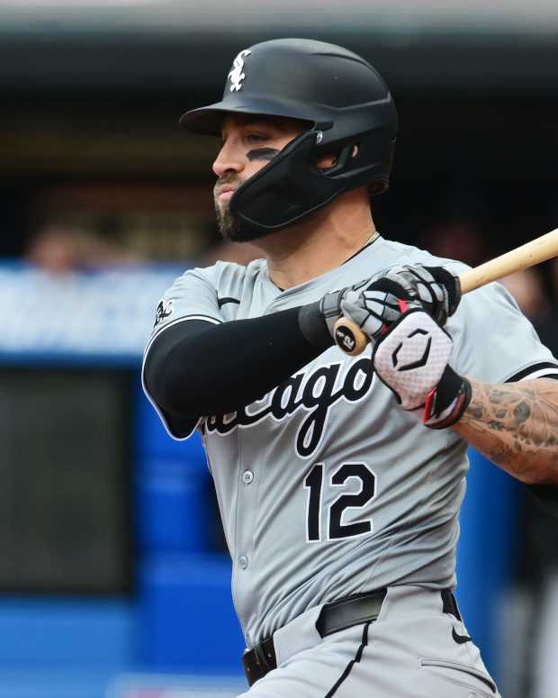 Apr 9, 2024; Cleveland, Ohio, USA; Chicago White Sox center fielder Kevin Pillar (12) hits an RBI double during the first inning against the Cleveland Guardians at Progressive Field.