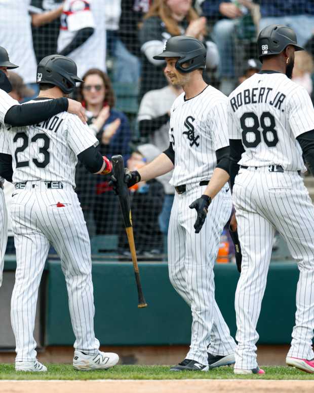 May 24, 2025; Chicago, Illinois, USA; Chicago White Sox players celebrate after scoring against the Texas Rangers during the sixth inning at Rate Field.