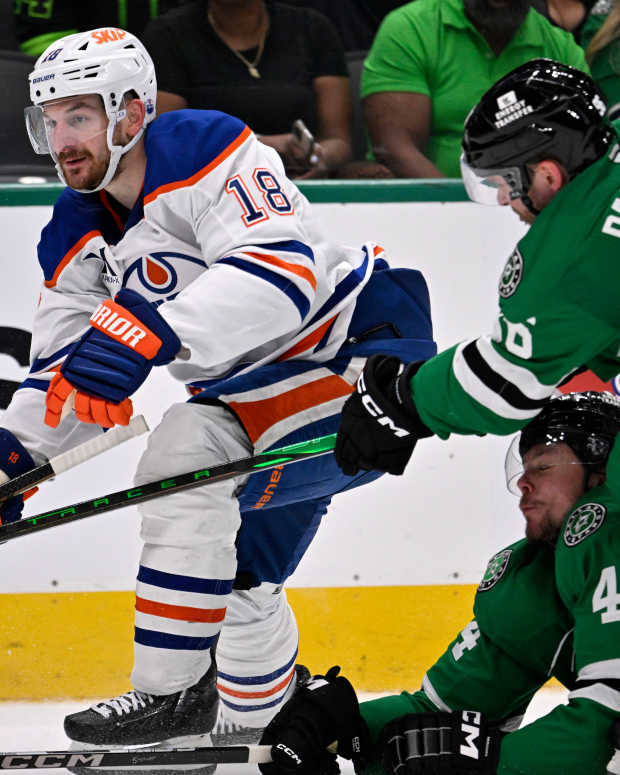 May 23, 2025; Dallas, Texas, USA; Dallas Stars right wing Mikko Rantanen (96) slashes Edmonton Oilers left wing Zach Hyman (18) in the third period for game two of the Western Conference Final of the 2025 Stanley Cup Playoffs at American Airlines Center.