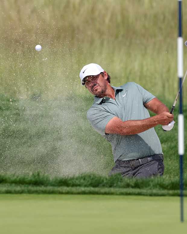 Jun 12, 2025; Oakmont, Pennsylvania, USA; Brooks Koepka plays a shot from a bunker on the eighth hole during the first round of the U.S. Open golf tournament.