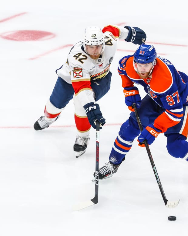 Jun 14, 2025; Edmonton, Alberta, CAN; Edmonton Oilers center Connor McDavid (97) controls the puck against Florida Panthers defenseman Gustav Forsling (42) during the third period in game five of the 2025 Stanley Cup Final at Rogers Place.