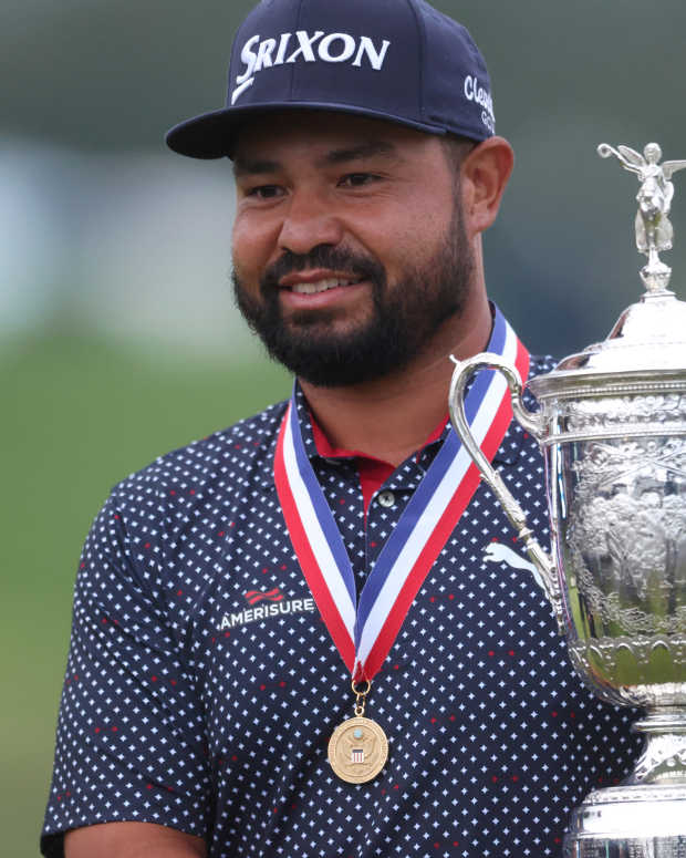 Jun 15, 2025; Oakmont, Pennsylvania, USA; JJ Spaun celebrates with the championship trophy after winning the 125th U.S. Open golf tournament.