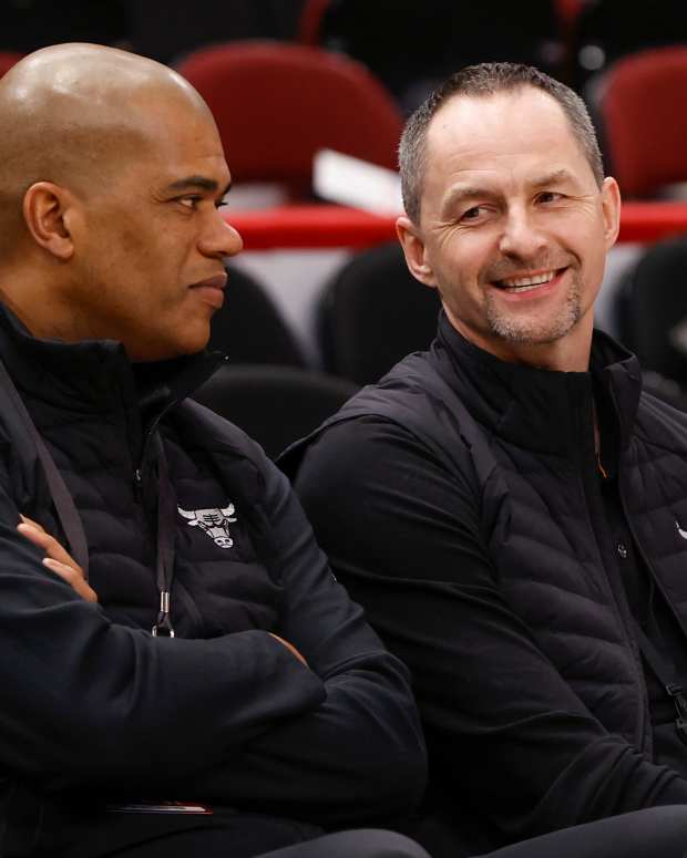 Apr 22, 2022; Chicago, Illinois, USA; Chicago Bulls executive vice president of basketball operations Arturas Karnisovas (right) talks with general manager Marc Eversley (left) before game three of the first round for the 2022 NBA playoffs against the Milwaukee Bucks at United Center.