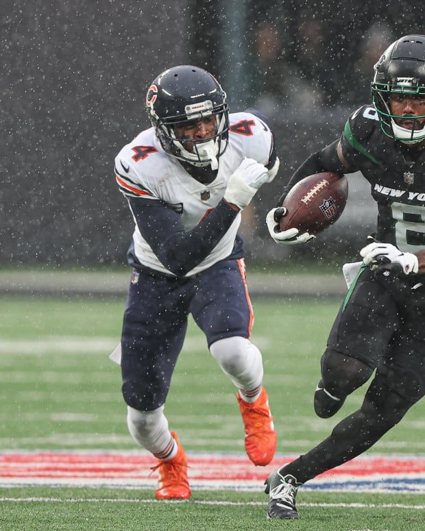Nov 27, 2022; East Rutherford, New Jersey, USA; New York Jets wide receiver Elijah Moore (8) gains yards after the catch as Chicago Bears safety Eddie Jackson (4) pursues during the first half at MetLife Stadium.