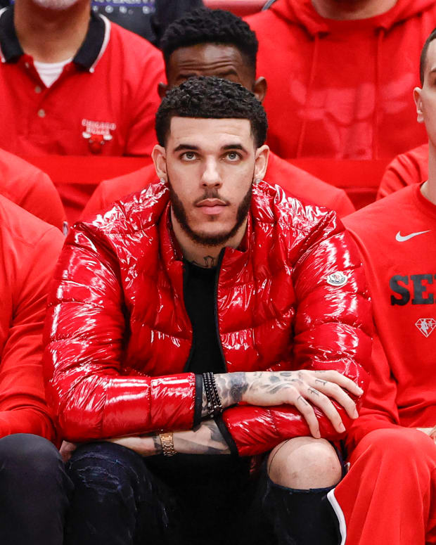 Apr 22, 2022; Chicago, Illinois, USA; Chicago Bulls guard Lonzo Ball (center) looks on from the bench during the second half of game three of the first round for the 2022 NBA playoffs against the Milwaukee Bucks at United Center.