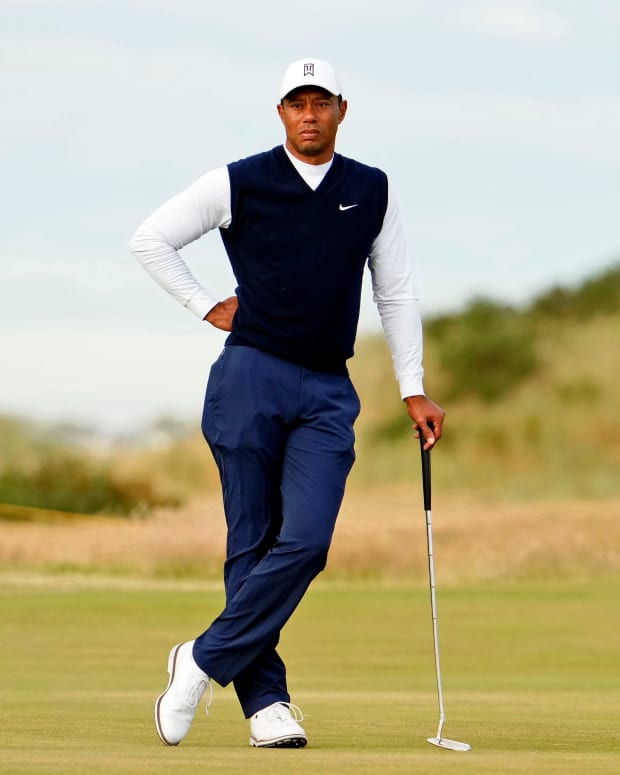 Jul 14, 2022; St. Andrews, SCT; Tiger Woods stands on the 13th green during the first round of the 150th Open Championship golf tournament at St. Andrews Old Course.