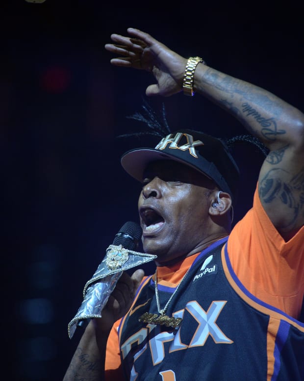 Grammy Award winner Coolio performing at a Phoenix Suns basketball game.
