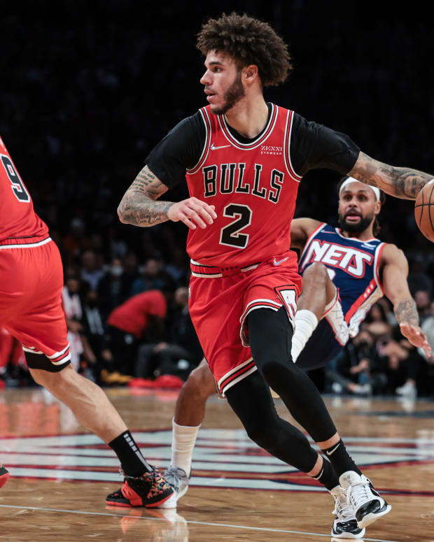 Dec 4, 2021; Brooklyn, New York, USA; Chicago Bulls guard Lonzo Ball (2) dribbles as Brooklyn Nets guard DeAndre' Bembry (95) is screened by center Nikola Vucevic (9) during the first half at Barclays Center.