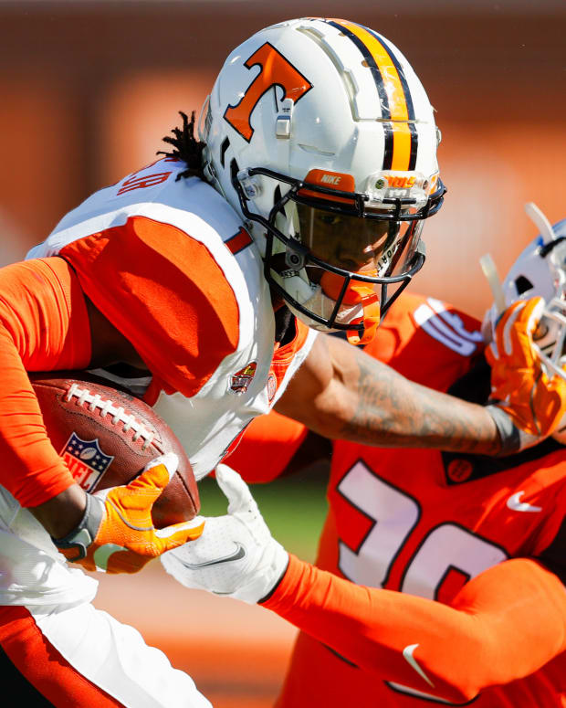 Feb 5, 2022; Mobile, AL, USA; American squad wide receiver Velus Jones Jr. of Tennessee (1) and National Squad cornerback Joshua Williams of Fayetteville State (30) in the first half during the Senior bowl at Hancock Whitney Stadium. Mandatory Credit: Nathan Ray Seebeck-USA TODAY Sports