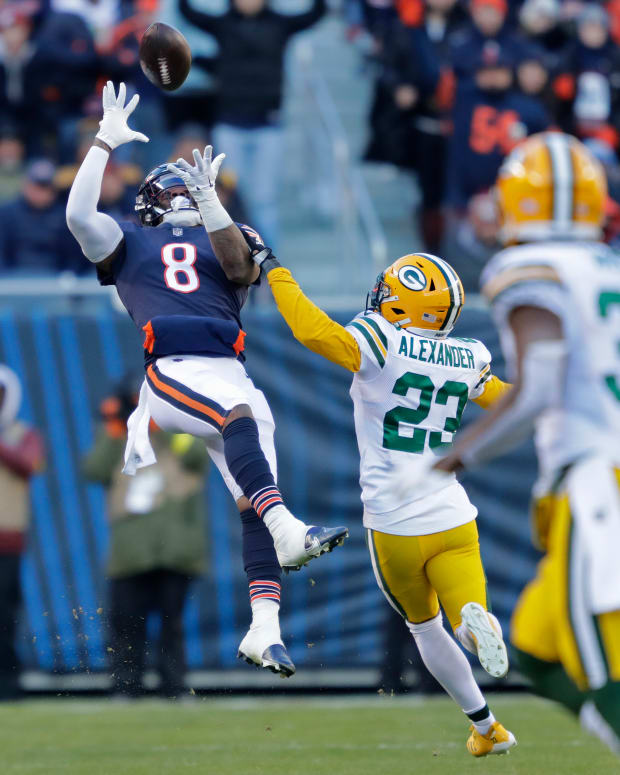 Dec 4, 2022; Chicago, Illinois, USA; Chicago Bears wide receiver N'Keal Harry (8) pulls down a 49-yard reception aginst Green Bay Packers cornerback Jaire Alexander (23) in the fourth quarter during their football game at Soldier Field. Mandatory Credit: Dan Powers-USA TODAY Sports