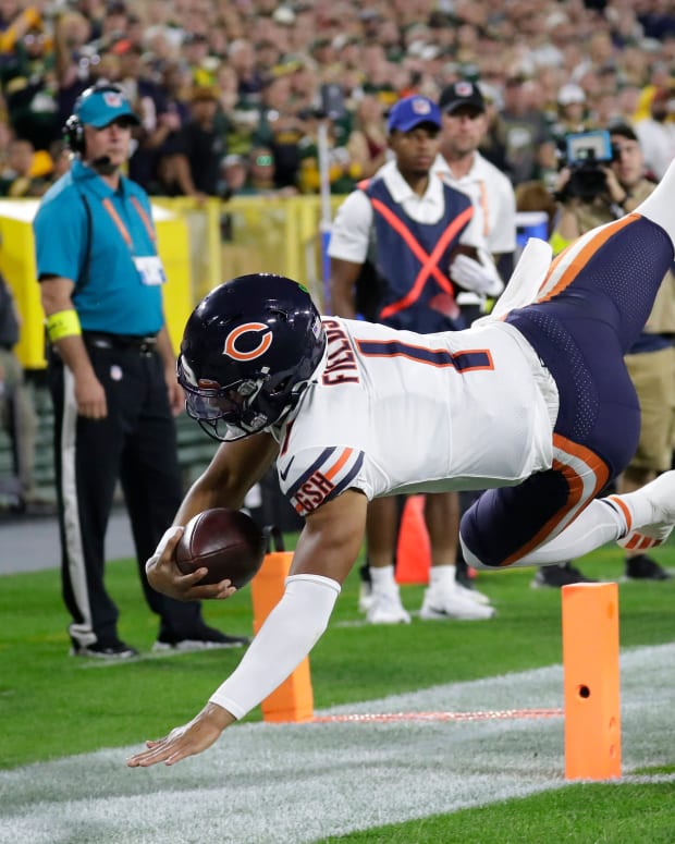 Sep 18, 2022; Green Bay, Wisconsin, USA; Chicago Bears quarterback Justin Fields (1) dives into the end zone for touchdown against the Green Bay Packers in the first quarter during their football game at Lambeau Field. Dan Powers/USA TODAY NETWORK-Wisconsin Nfl Chicago Bears At Green Bay Packers