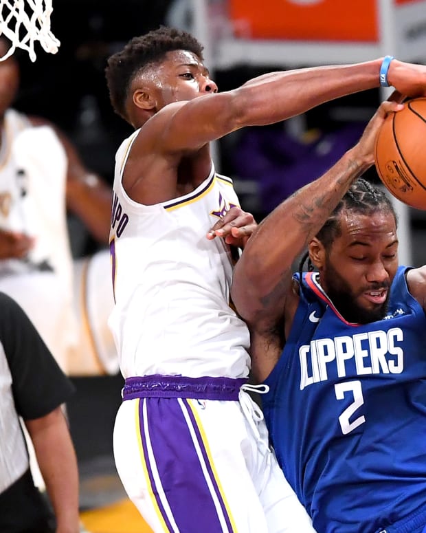 Dec 11, 2020; Los Angeles, California, USA; Los Angeles Lakers forward Kostas Antetokounmpo (37) battles Los Angeles Clippers forward Kawhi Leonard (2) for a rebound in the first half of the game at Staples Center.