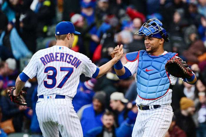 CHICAGO, ILLINOIS - APRIL 07: Pitcher David Robertson #37 and Willson Contreras #40 of the Chicago Cubs celebrate after securing a 5-4 win over the Milwaukee Brewers on Opening Day at Wrigley Field on April 07, 2022 in Chicago, Illinois. (Photo by Quinn Harris/Getty Images)