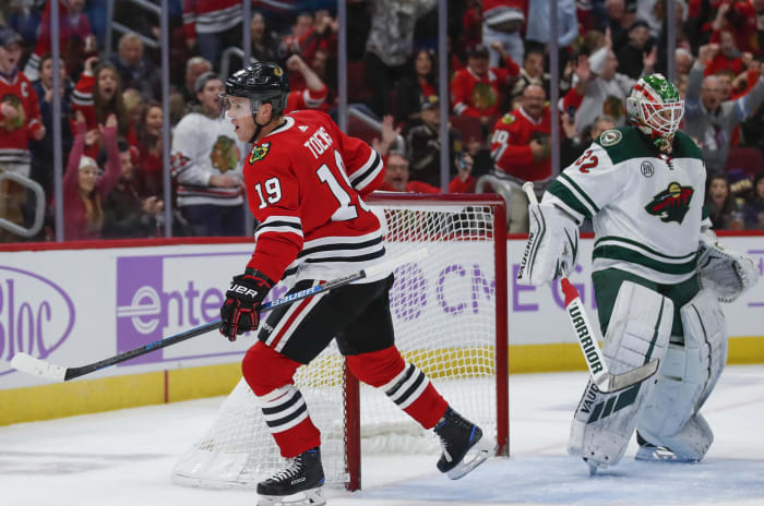Chicago Blackhawks center Jonathan Toews (19) reacts after scoring against Minnesota Wild goaltender Alex Stalock (32) during the first period of an NHL hockey game Sunday, Nov. 18, 2018, in Chicago. (AP Photo/Kamil Krzaczynski) ORG XMIT: CXA103