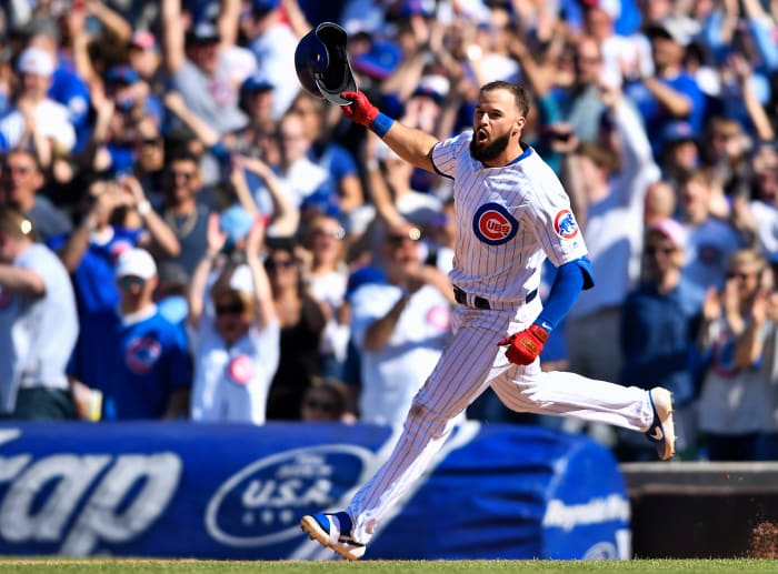 CHICAGO, ILLINOIS - APRIL 21: David Bote #13 of the Chicago Cubs celebrates after hitting a walk-off single against the Arizona Diamondbacks at Wrigley Field on April 21, 2019 in Chicago, Illinois. (Photo by Quinn Harris/Getty Images)