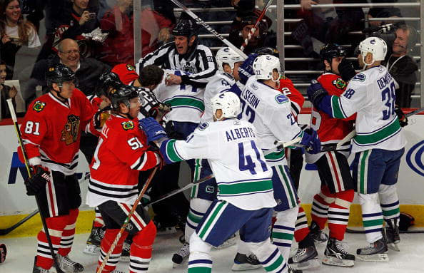 CHICAGO - MARCH 05: A melee breaks out between the Chicago Blackhawks and the Vancouver Canucks in the first minute of play after Andrew Ladd of the Blackhawks and Ryan Kesler of the Canucks start a fight at the United Center on March 5, 2010 in Chicago, Illinois. (Photo by Jonathan Daniel/Getty Images)