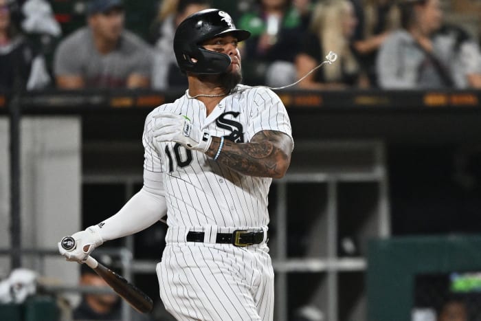 Sep 24, 2022; Chicago, Illinois, USA; Chicago White Sox infielder Yoan Moncada's (10) chain flies off after it breaks while hitting a fly ball in the fifth inning against the Detroit Tigers at Guaranteed Rate Field.
