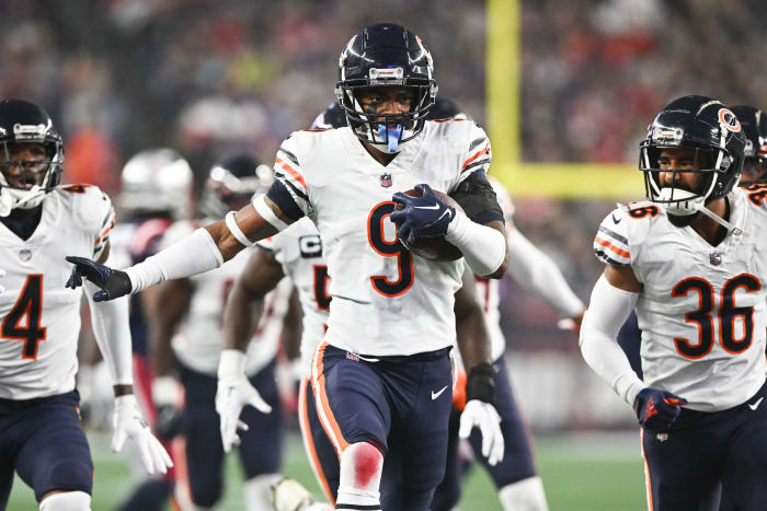 Oct 24, 2022; Foxborough, Massachusetts, USA; Chicago Bears safety Jaquan Brisker (9) runs with the ball and celebrates after an interception against the New England Patriots during the first half at Gillette Stadium. Mandatory Credit: Brian Fluharty-USA TODAY Sports