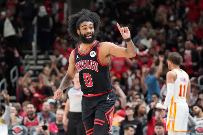 Apr 17, 2024; Chicago, Illinois, USA; Chicago Bulls guard Coby White (0) gestures after making a three point basket against the Atlanta Hawks during the second half during a play-in game of the 2024 NBA playoffs at United Center.