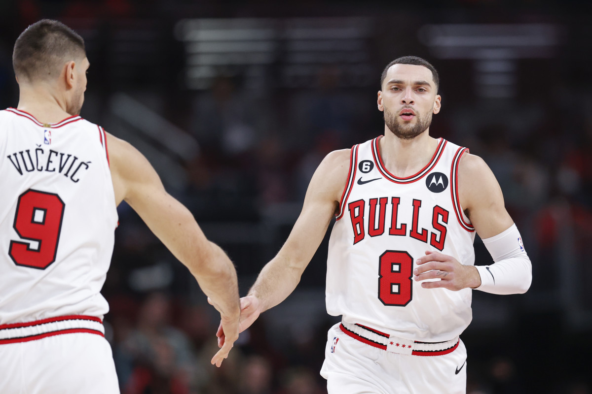 Dec 7, 2022; Chicago, Illinois, USA; Chicago Bulls guard Zach LaVine (8) is congratulated by center Nikola Vucevic (9) after scoring against the Washington Wizards during the first half at United Center.