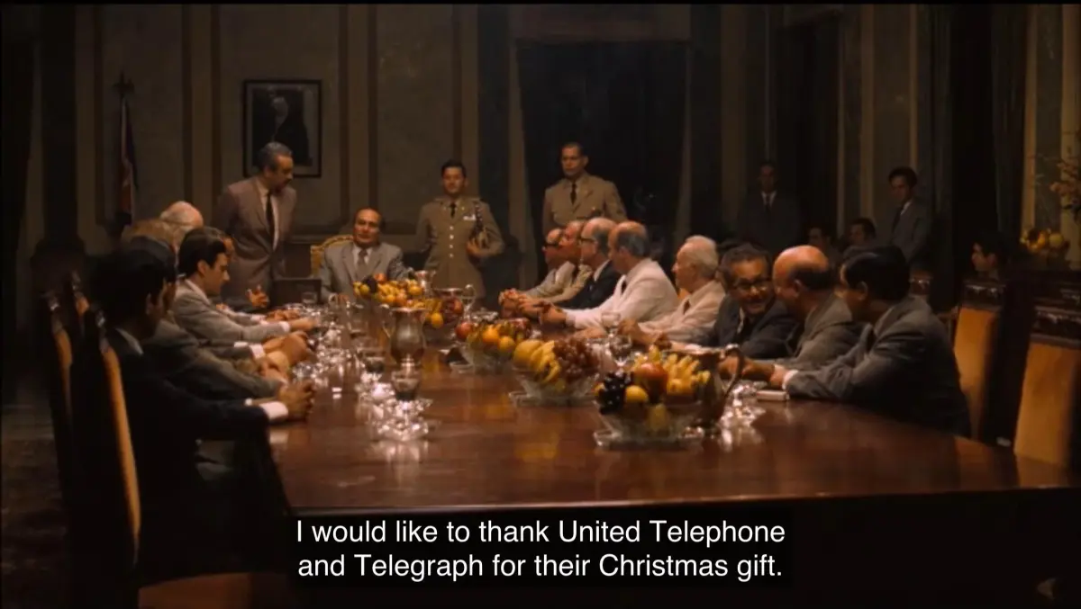 United Telephone and Telegraph presents its all-gold telephone Christmas gift at the Havana meeting in The Godfather Part II