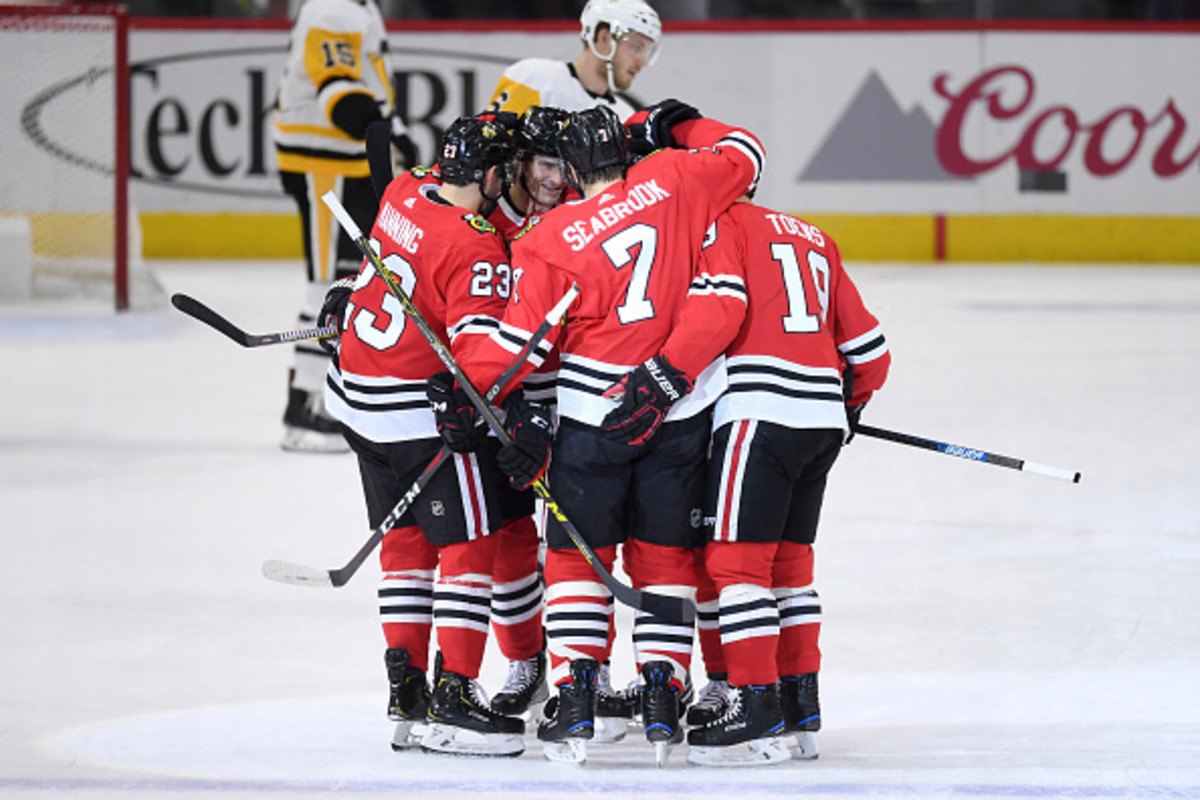 CHICAGO, IL - DECEMBER 12: Chicago Blackhawks defenseman Brent Seabrook (7) celebrates his goal with teammates in first period action of an NHL game between the Chicago Blackhawks and the Pittsburgh Penguins on December 12, 2018 at the United Center in Chicago, IL. (Photo by Robin Alam/Icon Sportswire via Getty Images)