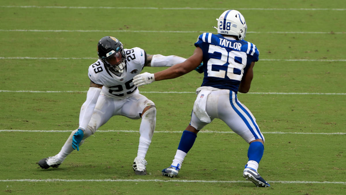 JACKSONVILLE, FLORIDA - SEPTEMBER 13: Josh Jones #29 of the Jacksonville Jaguars attempts to tackle Jonathan Taylor #28 of the Indianapolis Colts  during the game at TIAA Bank Field on September 13, 2020 in Jacksonville, Florida. (Photo by Sam Greenwood/Getty Images)