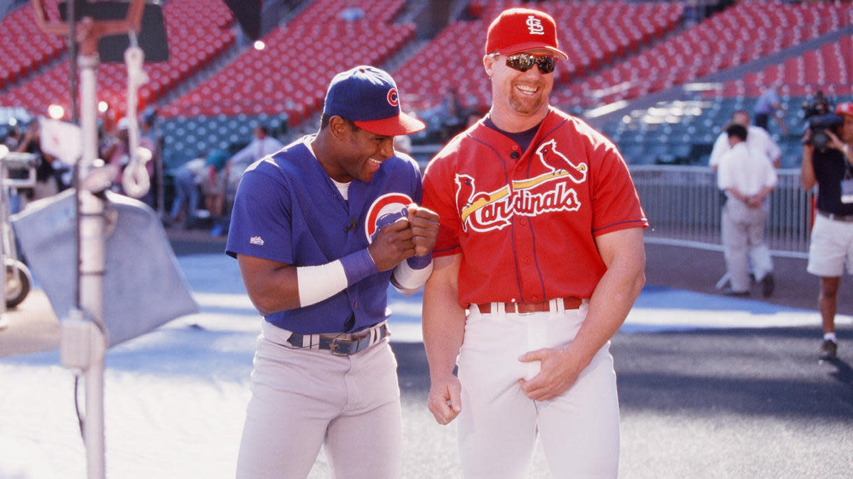 ST. LOUIS, MO - SEPTEMBER 7: Mark McGwire of the St. Louis Cardinals and Sammy Sosa of the Chicago Cubs joke before the game at Busch Stadium on September 7, 1998 in St. Louis, Missouri. (Photo by Sporting News via Getty Images via Getty Images)