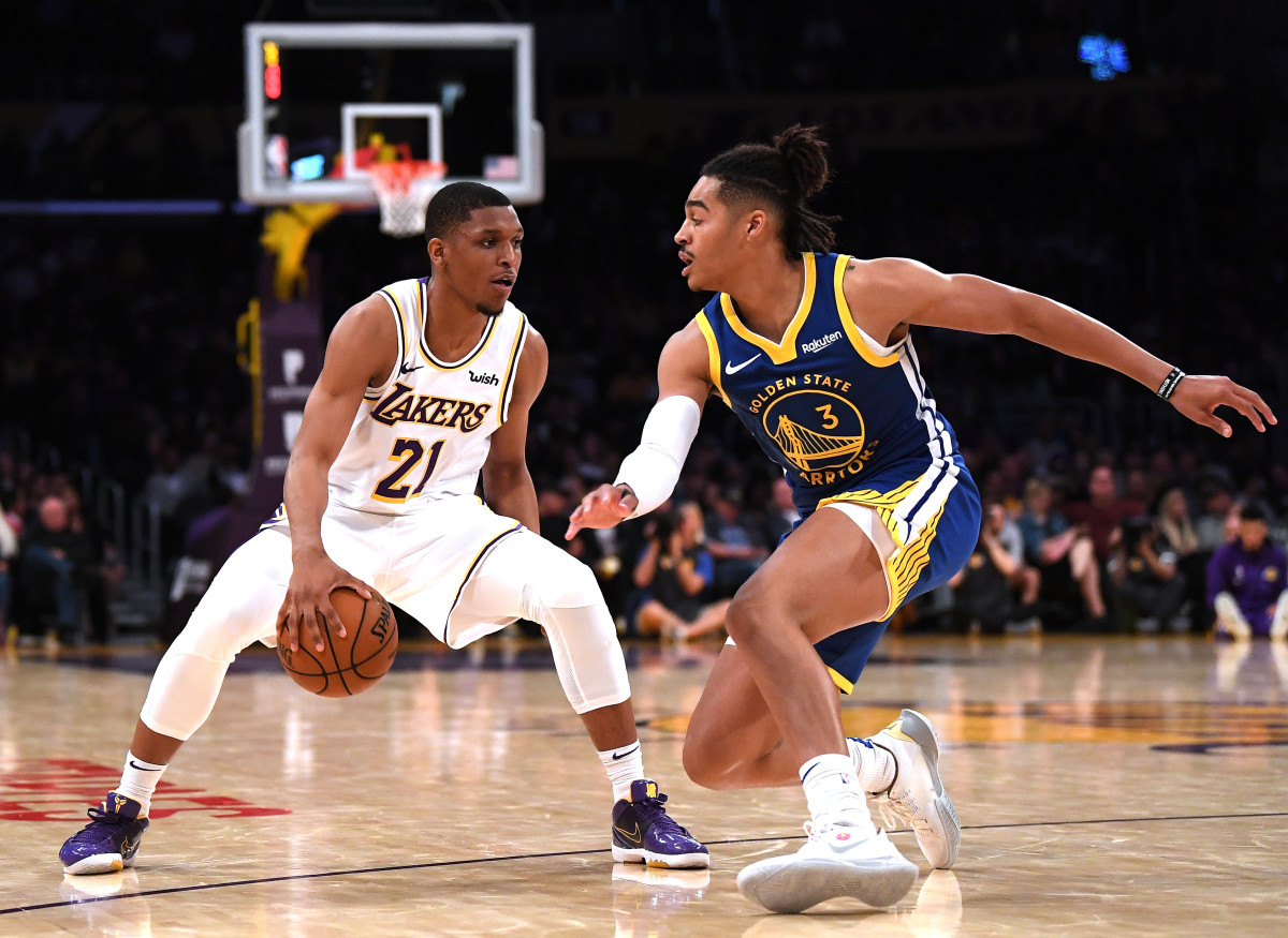LOS ANGELES, CALIFORNIA - OCTOBER 14:  Zach Norvell Jr. #21 of the Los Angeles Lakers crosses over on Jordan Poole #3 of the Golden State Warriors during a 104-98 Lakers preseason win at Staples Center on October 14, 2019 in Los Angeles, California. (Photo by Harry How/Getty Images)