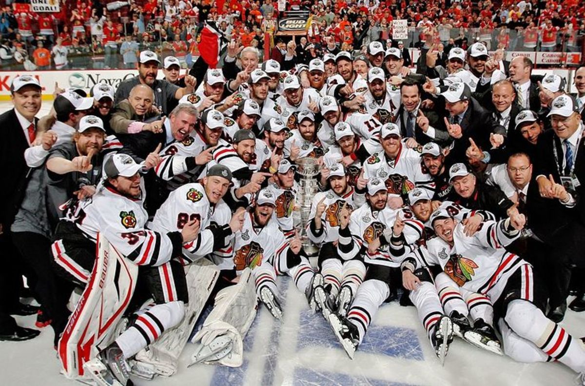 PHILADELPHIA - JUNE 09:  Members of the Chicago Blackhawks celebrate winning the Stanley Cup after defeating the Philadelphia Flyers 4-3 in Game Six of the 2010 NHL Stanley Cup Final at the Wachovia Center on June 9, 2010 in Philadelphia, Pennsylvania.  (Photo by Len Redkoles/NHLI via Getty Images)
