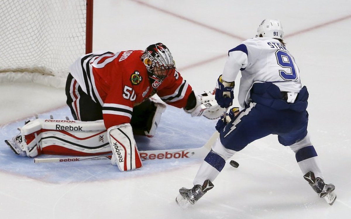 Crawford makes 1 of his 25 saves on a Steven Stamkos breakaway to help secure a 2-0 win in Game 6 of the 2015 Stanley Cup Final.Photo: Charles Rex Arbogast/AP