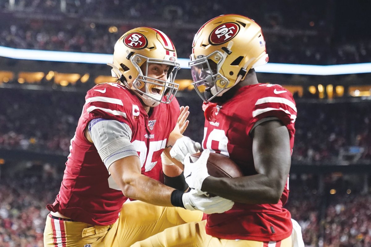 San Francisco 49ers wide receiver Deebo Samuel, right, is congratulated by tight end George Kittle after scoring against the Green Bay Packers during the first half of an NFL football game in Santa Clara, Calif., Sunday, Nov. 24, 2019. (AP Photo/Tony Avelar)