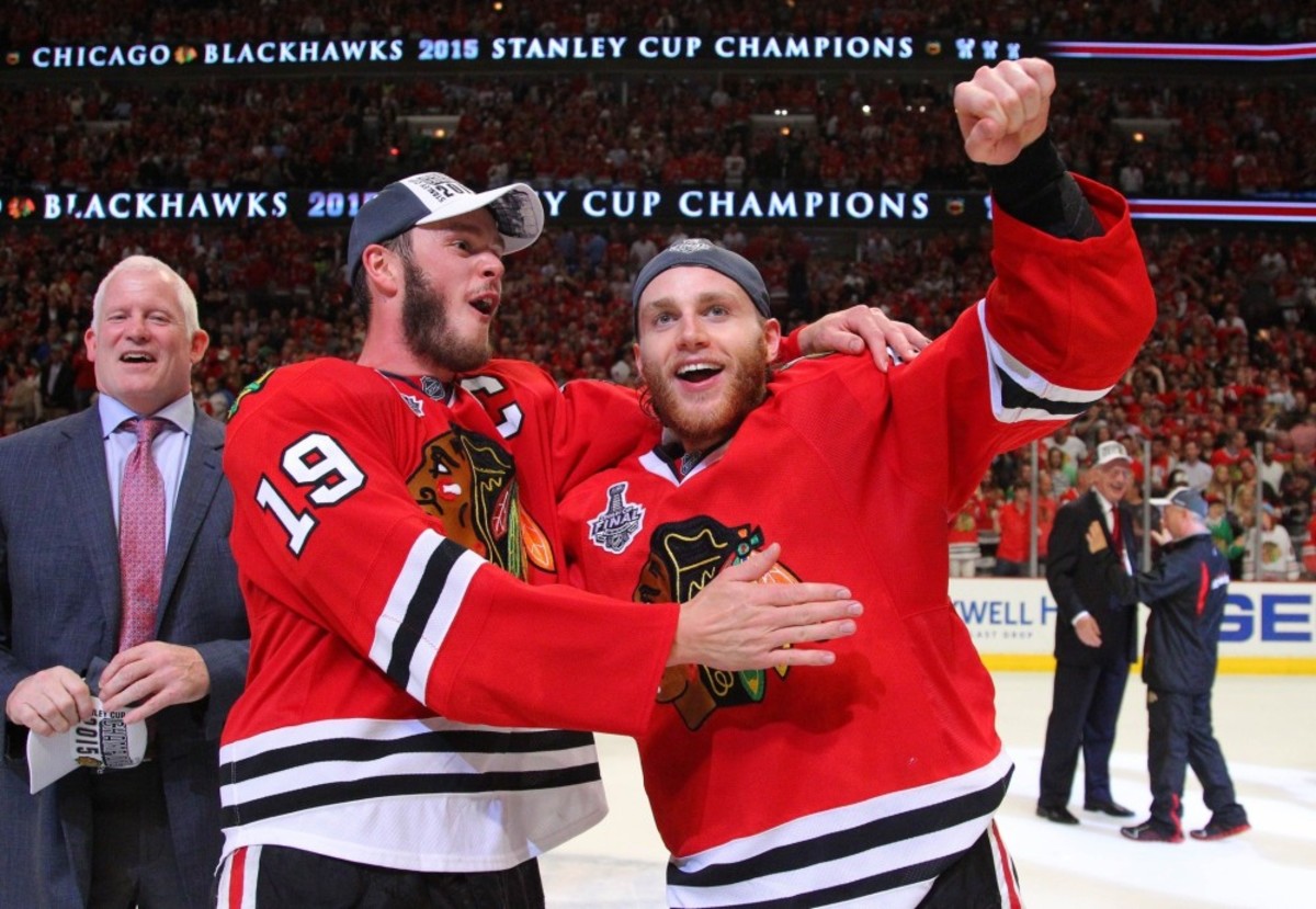 Jonathan Toews and Patrick Kane celebrate the Chicago Blackhawks 2015 Stanley Cup win on the ice at the United Center