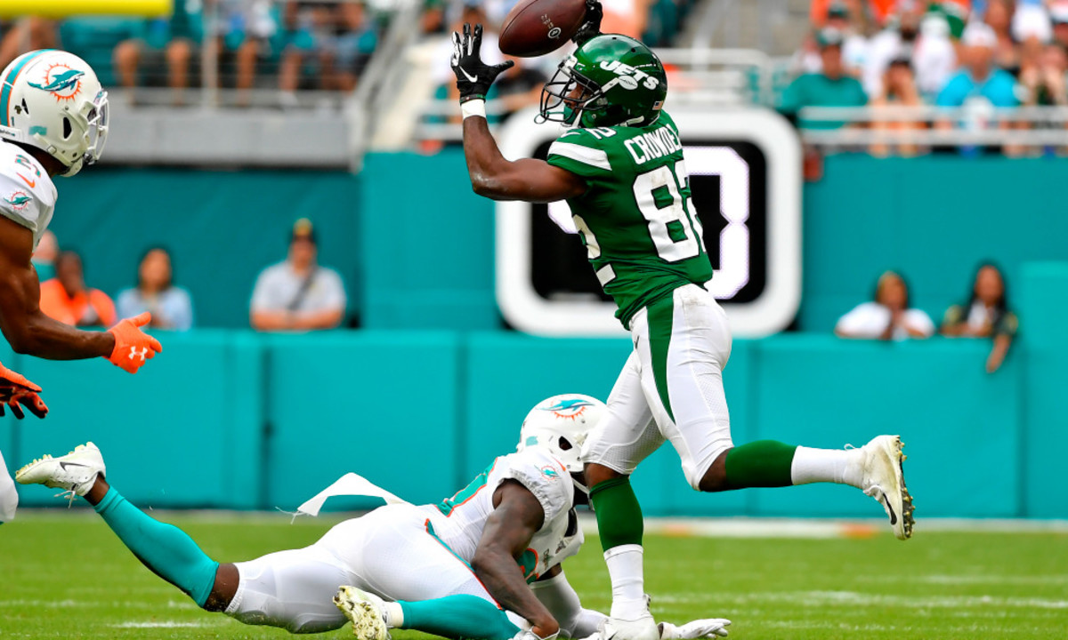 Nov 3, 2019; Miami Gardens, FL, USA; New York Jets wide receiver Jamison Crowder (82) makes a catch in front of Miami Dolphins defensive back Chris Lammons (30) during the first half at Hard Rock Stadium. Mandatory Credit: Steve Mitchell-USA TODAY Sports