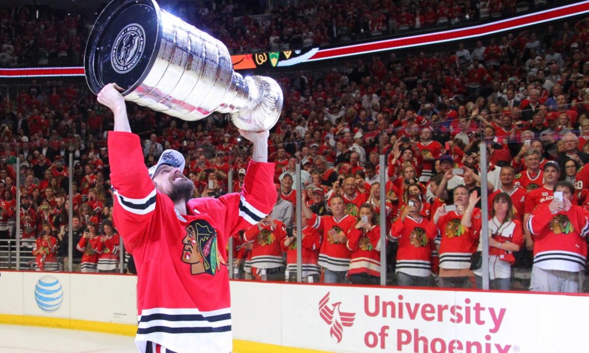 Jun 15, 2015; Chicago, IL, USA; Chicago Blackhawks left wing Patrick Sharp (10) hoists the Stanley Cup after defeating the Tampa Bay Lightning in game six of the 2015 Stanley Cup Final at United Center. Mandatory Credit: Dennis Wierzbicki-USA TODAY Sports ORG XMIT: USATSI-225748 ORIG FILE ID:  20150615_jel_aw6_171.jpg